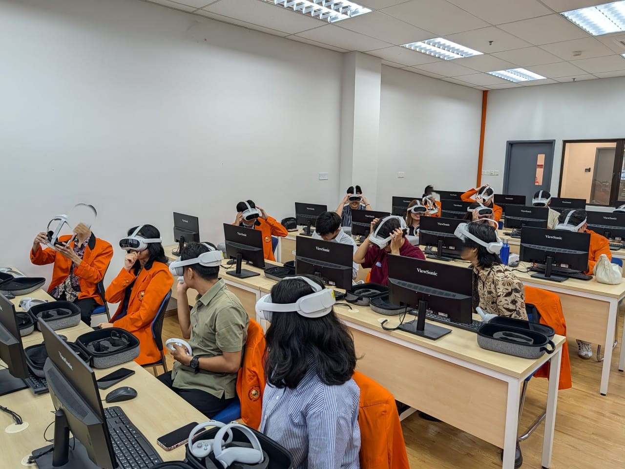 VR classroom session with headsets and desktop stations